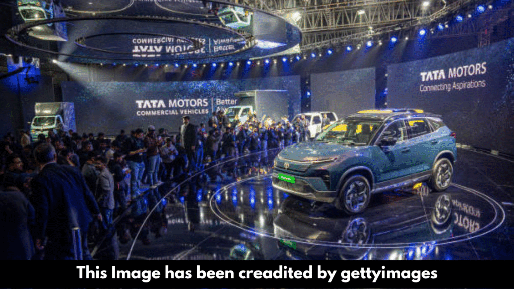 "Tata Motors shares fall on weak outlook despite deal."