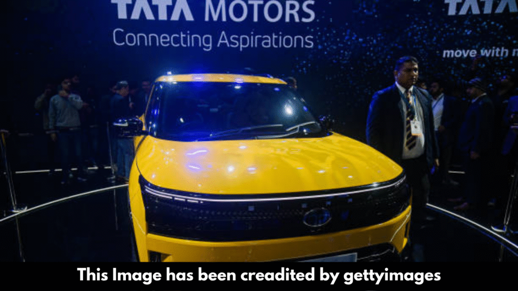 "Tata Motors shares fall on weak outlook despite deal."