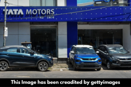 "Tata Motors shares fall on weak outlook despite deal."