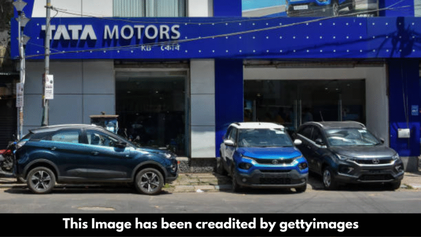 "Tata Motors shares fall on weak outlook despite deal."